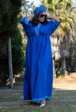 Royal blue geometric maxi dress with wide sleeves and patterned neck and cuff trim