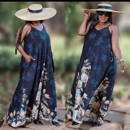 Navy botanical maxi dress, sleeveless, flared hem with blue floral print