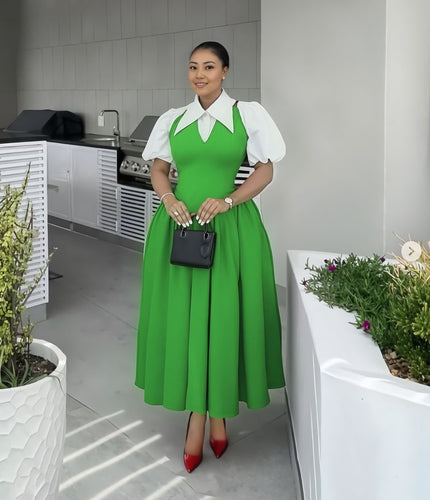 Lime-green pleated midi dress with white puff sleeves and contrast collared bodice