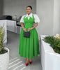 Lime-green pleated midi dress with white puff sleeves and contrast collared bodice