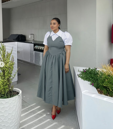 Blue-gray pleated midi dress with white puff sleeves and contrast collar