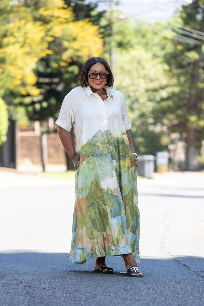 Maxi dress with white top and abstract landscape print skirt in green and blue
