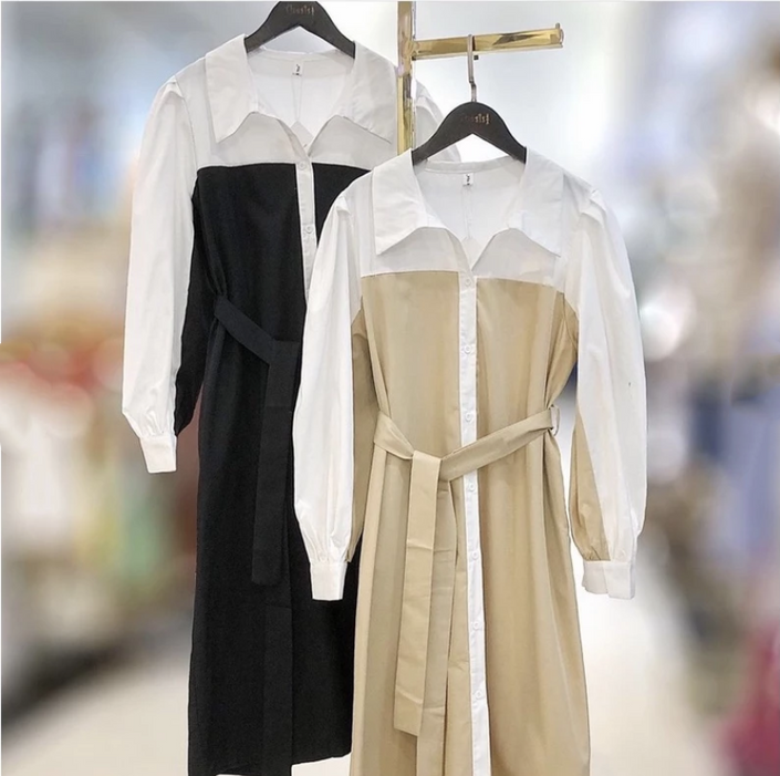 Two patchwork midi shirt dresses on hangers: black/white and beige/white with belts