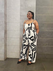 White & black abstract wide-leg jumpsuit with spaghetti straps, wide legs