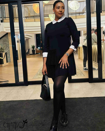 Pleated black midi dress with contrast white collar, long sleeves, gathered pleat skirt