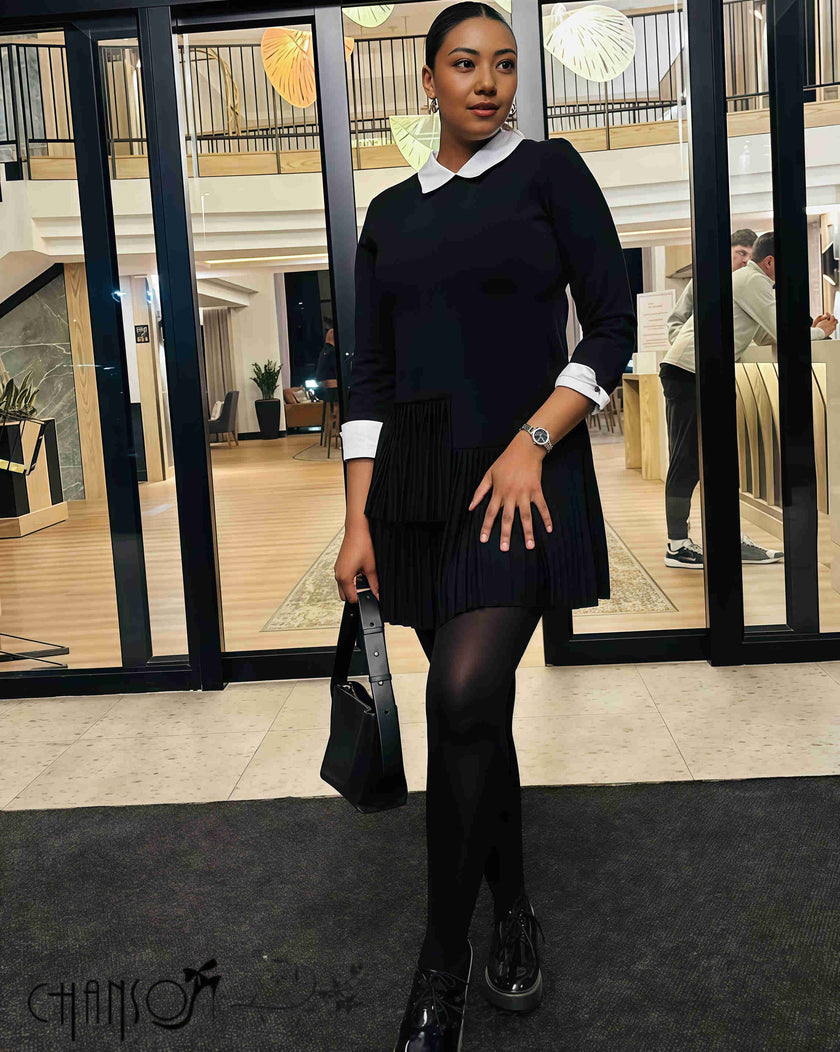 Pleated black midi dress with contrast white collar, long sleeves, gathered pleat skirt