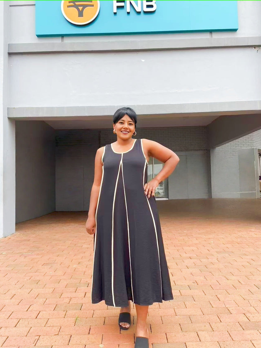 Dark sleeveless A-line maxi dress with light trim and scoop neck