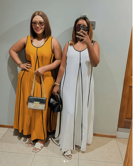 Goldenrod and white sleeveless A-line maxi dresses with black trim and scoop neck
