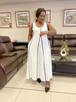 White sleeveless A-line maxi dress with black trim and vertical front seam