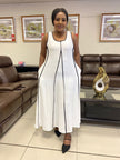 White sleeveless A-line maxi dress with black trim and full-length skirt