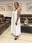 White sleeveless A-line maxi dress with black-trimmed neckline and long skirt