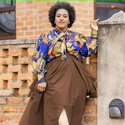 Floral puff-sleeve blouse with neck bow, paired with brown tiered skirt
