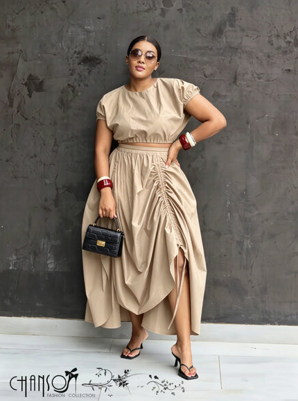 Nude ruched maxi skirt with adjustable waist, draped folds and side slit