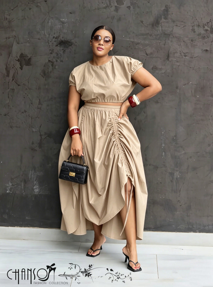Nude maxi skirt with ruched waist and gathered, draped side overlay