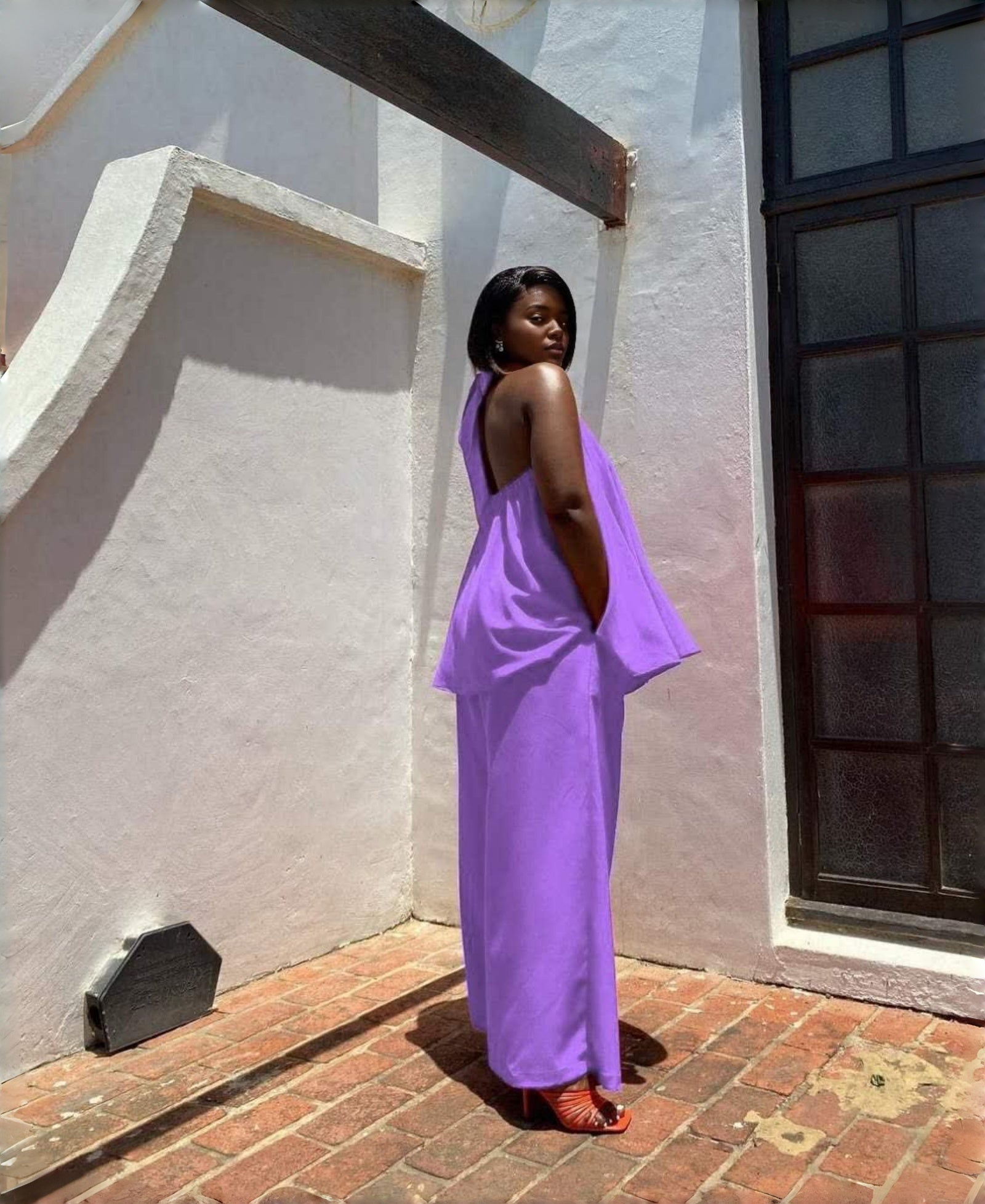 Light-purple sleeveless twin set top and wide-leg pants, open-back drape
