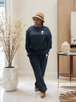 Dark two-piece jogger set with sweatshirt and matching tapered jogger pants