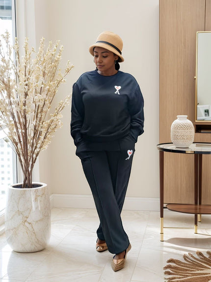 Dark two-piece jogger set with sweatshirt and matching tapered jogger pants
