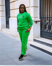 Emerald-green two-piece jogger set with crewneck sweatshirt and matching joggers