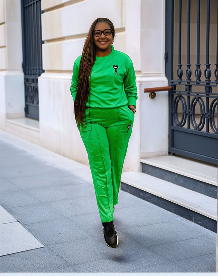 Emerald-green two-piece jogger set with crewneck sweatshirt and stitched leg emblem