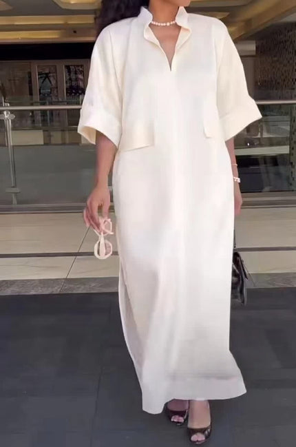 White short-sleeve midi dress with V-neck and patch pockets