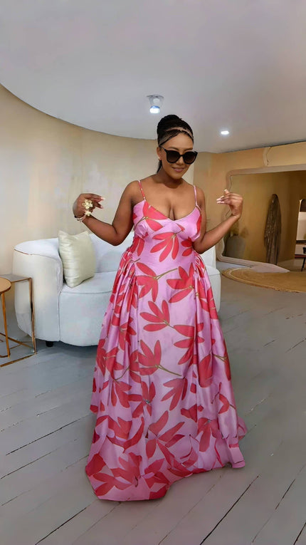 Flared maxi dress with pink and red leaf print, spaghetti straps and V-neck