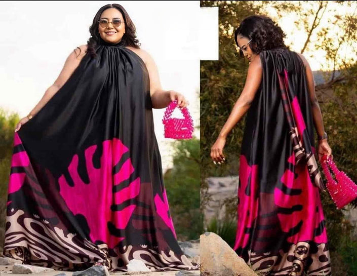 Halter maxi dress with bold pink and dark abstract floral print, sleeveless with halter neck