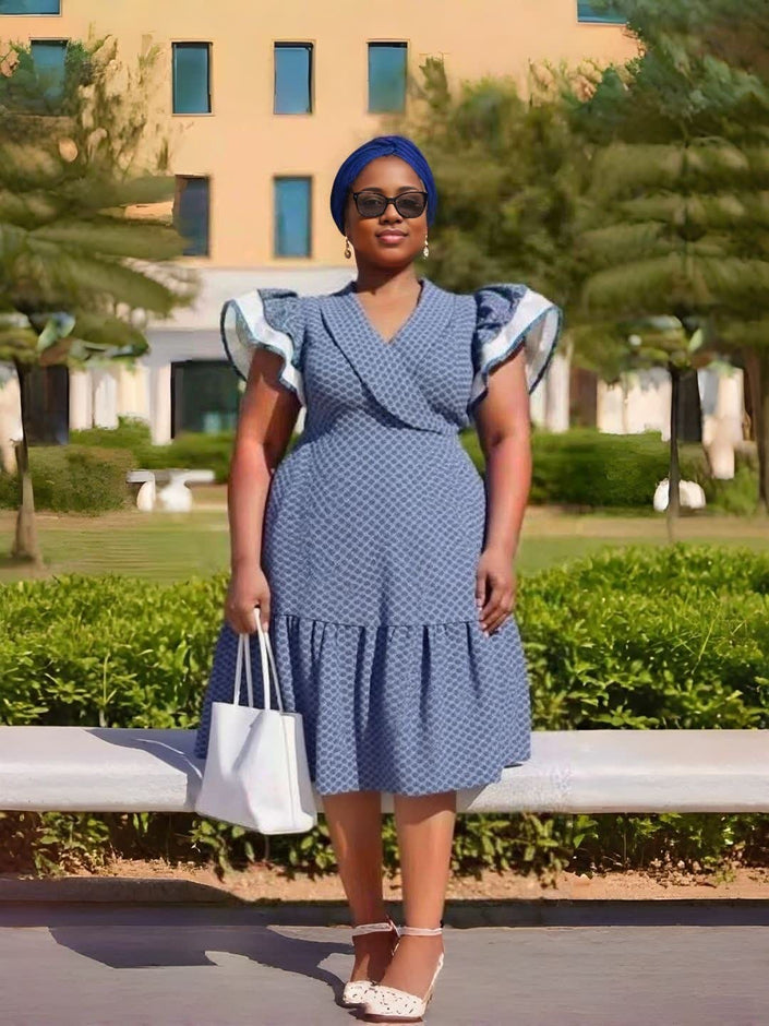 Vintage-style printed dress with ruffle sleeves, blue V-neck and tiered skirt hem