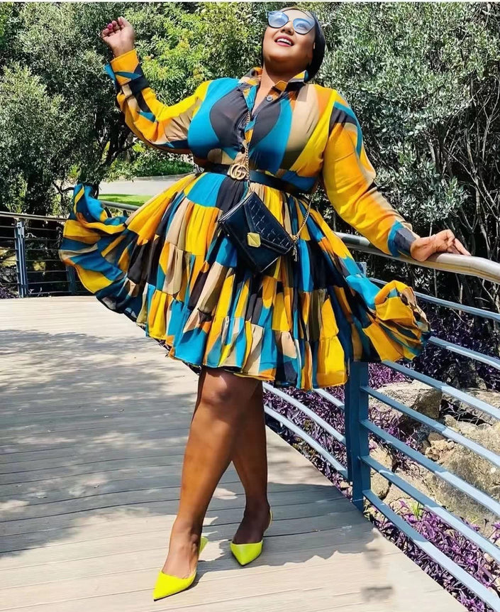 Plus-size geometric patchwork dress, belted waist, long sleeves, multicolor blocks