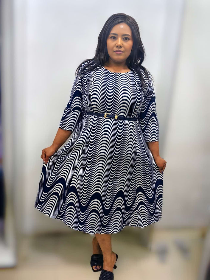 Navy and white wavy print midi dress with belted waist, three-quarter sleeves