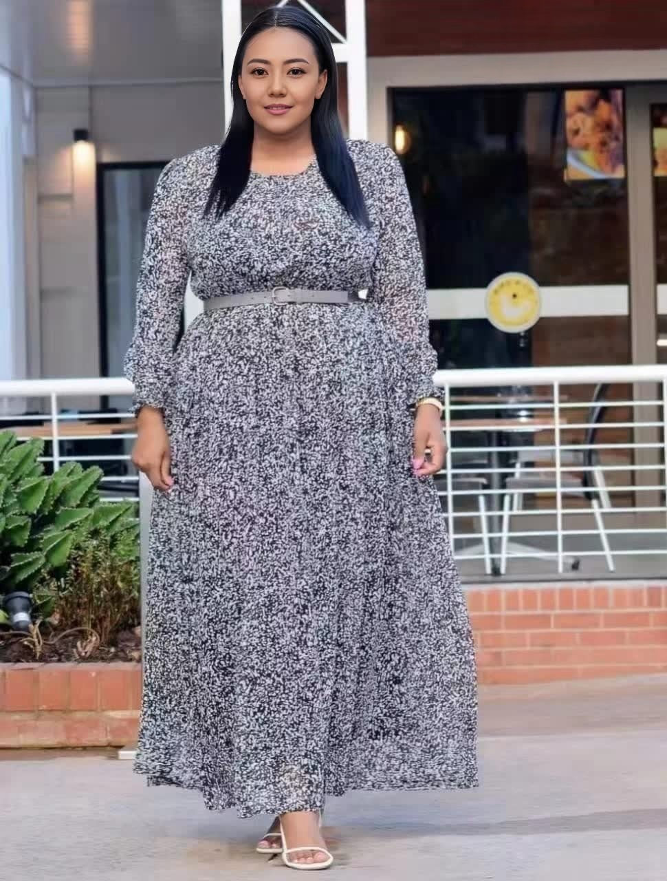 Plus size maxi dress with long sleeves, stretch waist, black speckled print