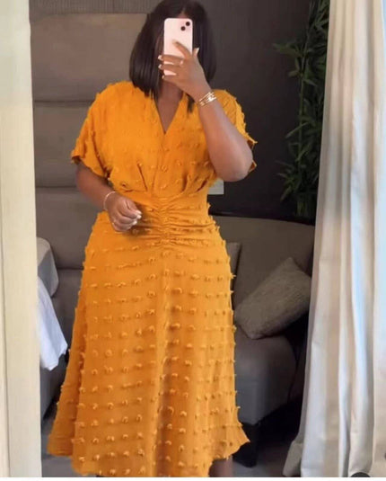 Yellow textured dot midi dress, cinched waist and V-neck, short sleeves