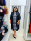 Plus size midi dress in black with white swirl wave print, 3/4 sleeves, midi length hem