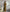 Button-Front Ribbed Knit Midi Dress with Long Sleeves and Pleated Hem Design