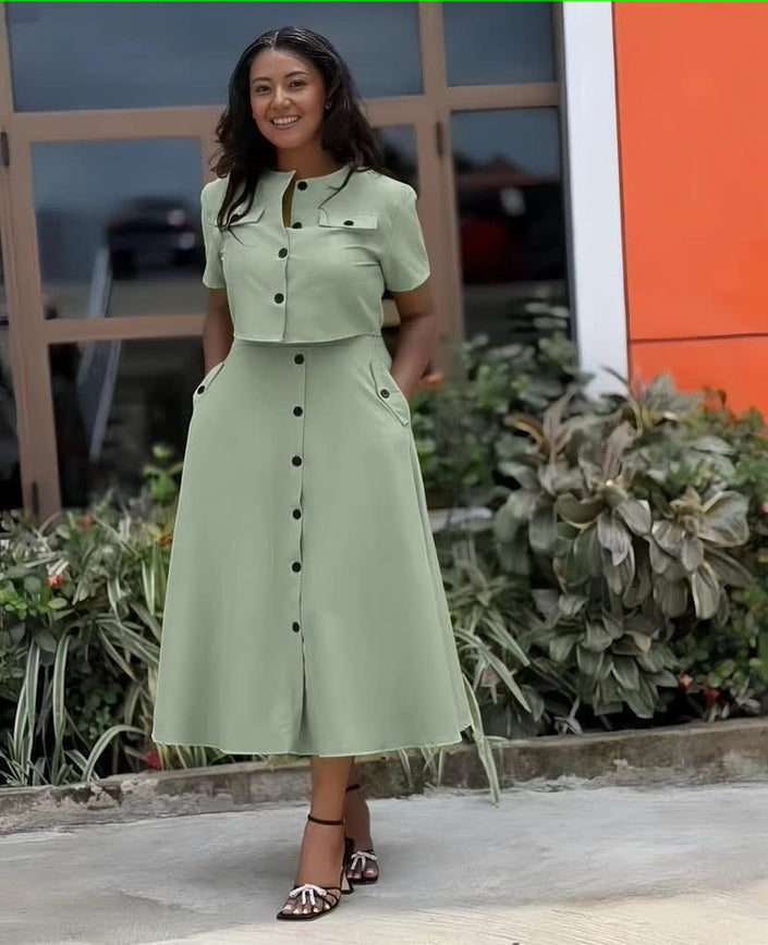 Light green collared waist-fit midi dress with short sleeves, button front, and side pockets