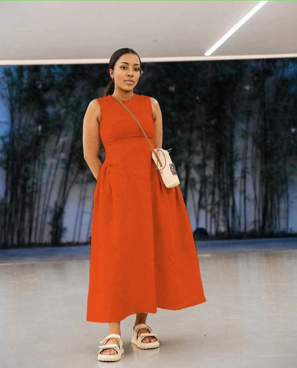 Orange sleeveless maxi dress with pleated waist and full A-line skirt