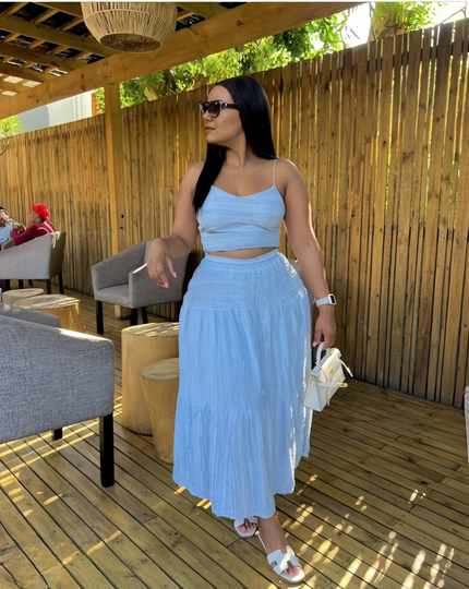 Sky-blue pleated maxi skirt with gathered tiers and adjustable waistband