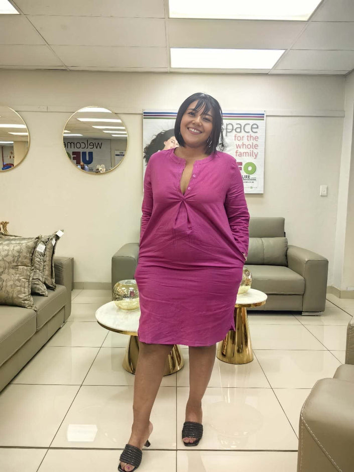 Rose-red shirt dress with V-neck front and three-quarter sleeves, knee length.