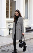 Plaid long coat with long sleeves, button front and side flap pockets, tailored fit