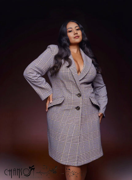 Plaid wool coat with notched lapels, single-breasted buttons, and side pockets