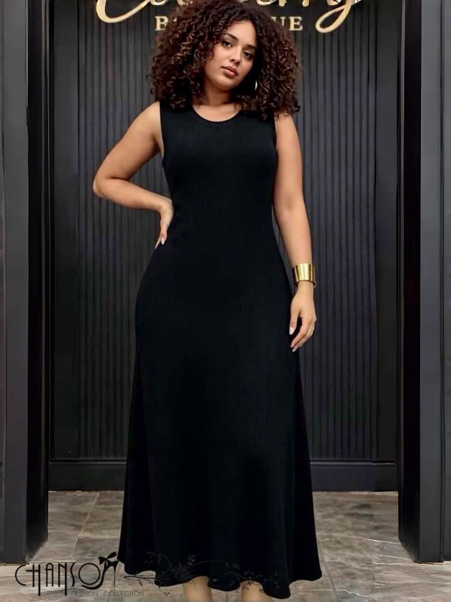 Black ribbed knit A-line midi dress, sleeveless with round neckline