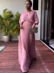 Pink pleated maxi dress with V-neck and batwing sleeves, full-length flowing skirt