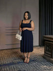 Dark navy pleated midi dress, sleeveless with square neckline and adjustable straps