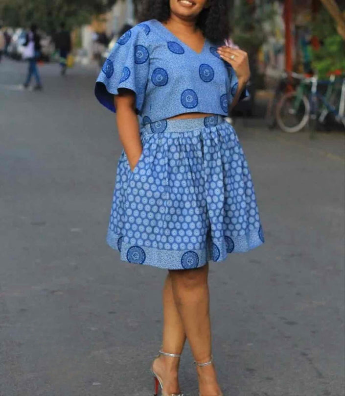 Blue patterned puff-sleeve top with pleated skirt twin set