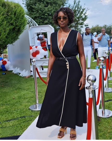 Black sleeveless V-neck midi dress with button accent and white piping