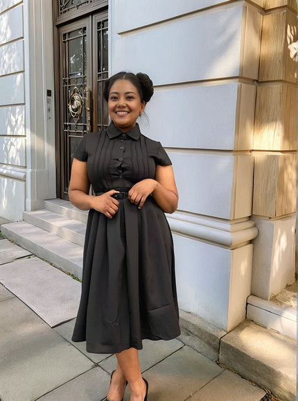 Black belted midi dress with button front, short sleeves, pleated skirt, tie waist