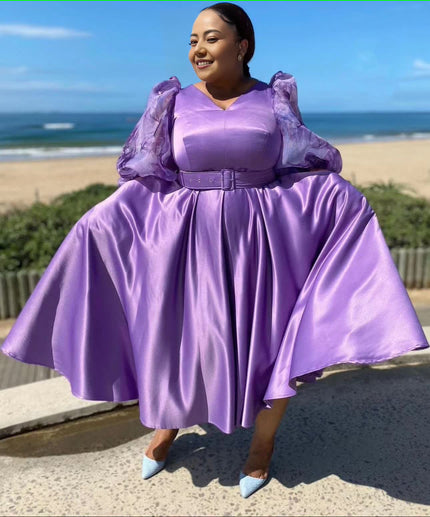 Purple satin midi dress with puff sleeves, waist belt, and pleated full skirt