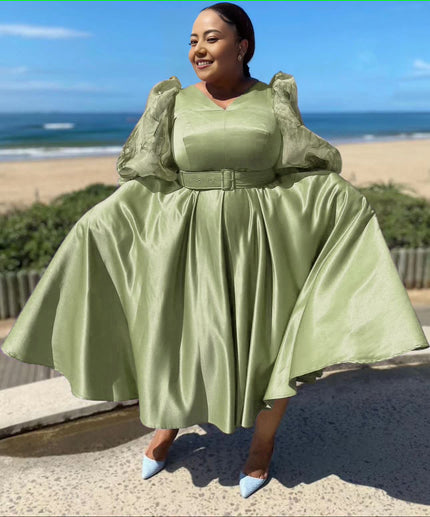 Olive satin midi dress with puff sleeves, waist belt, and gathered full skirt