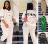 White loose-fit lettered top and pants set, button front, cuffed sleeves, eyelet hem