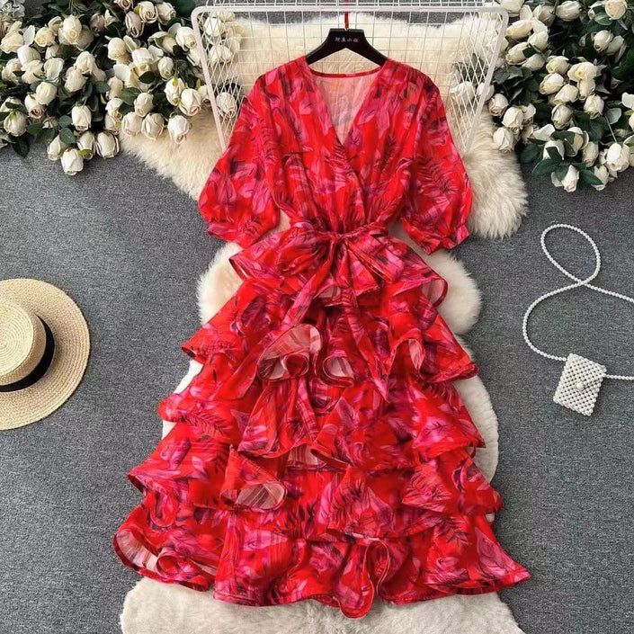 Red layered ruffle midi dress with V-neck, puff sleeves, and tied waist