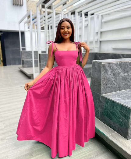Hot-pink sleeveless maxi dress with square neckline and pleated full skirt